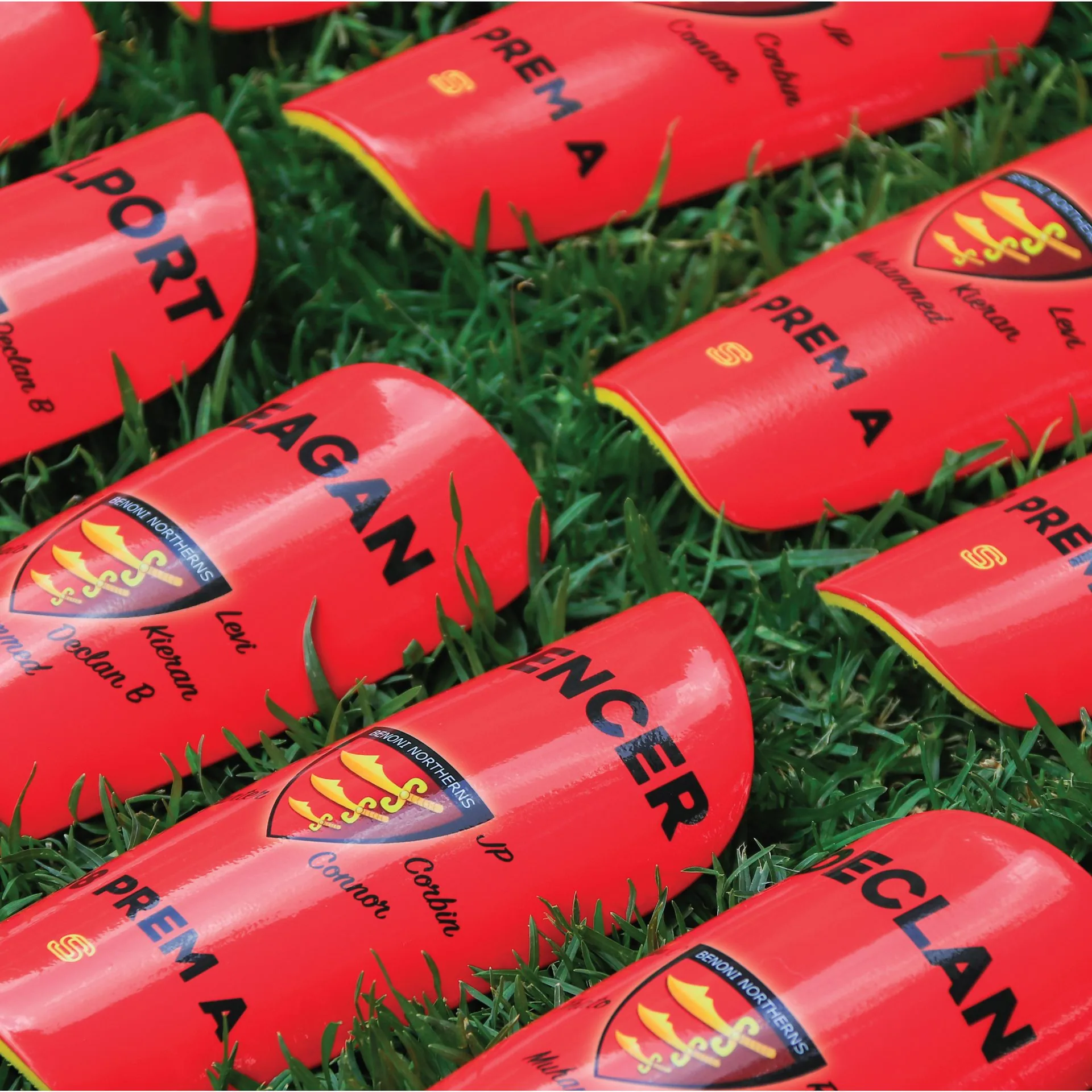 Custom red club shin pads