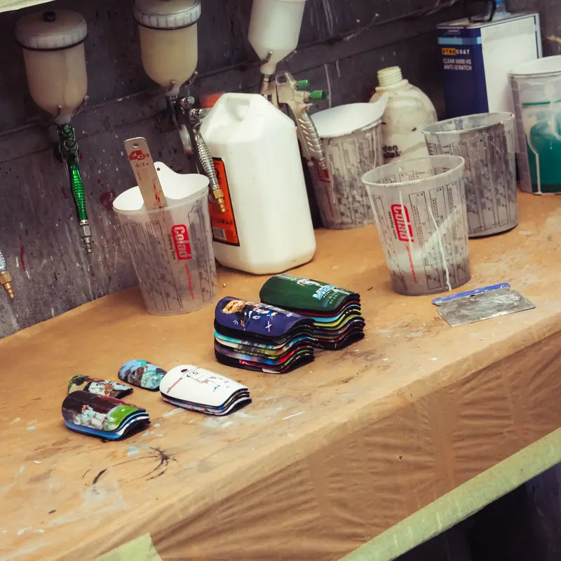 Custom shin pads in the spray workshop before clear coat