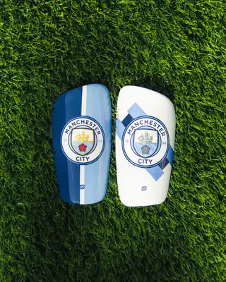Manchester City shin pads, sky blue stripe and white