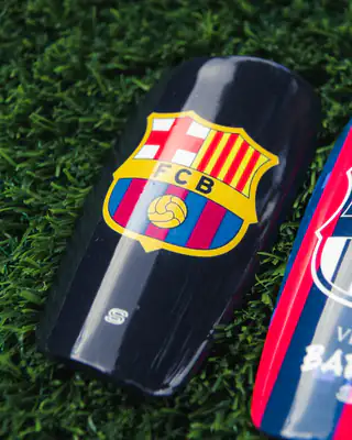 Close-up of an FC Barcelona crest shin pad