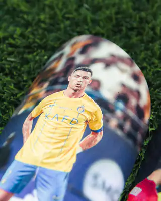 Ronaldo in Al Nassr yellow on a shin pad
