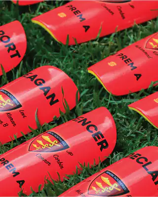 Custom red club shin pads