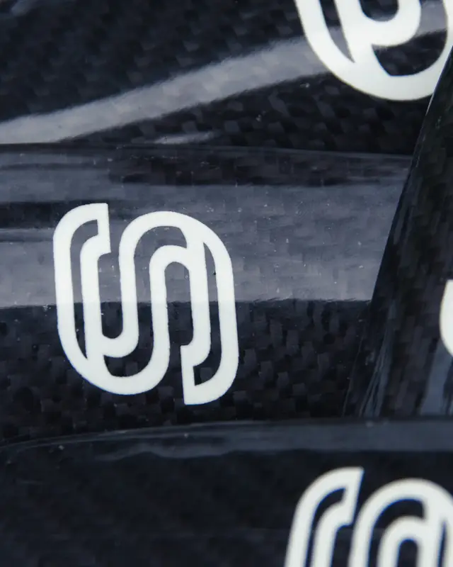 Strapzy's S logo on the carbon fibre weave