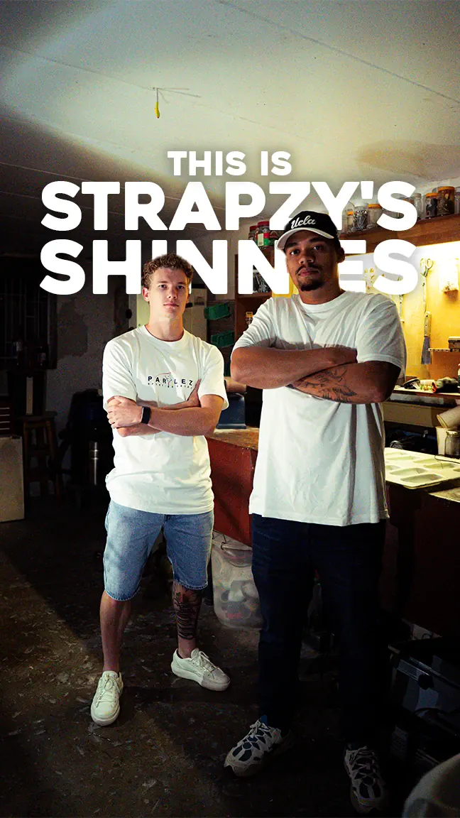 The two Strapzy's Shinnies founders standing arms crossed in their workshop