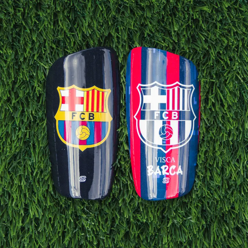 Pair of custom shin pads in club colours