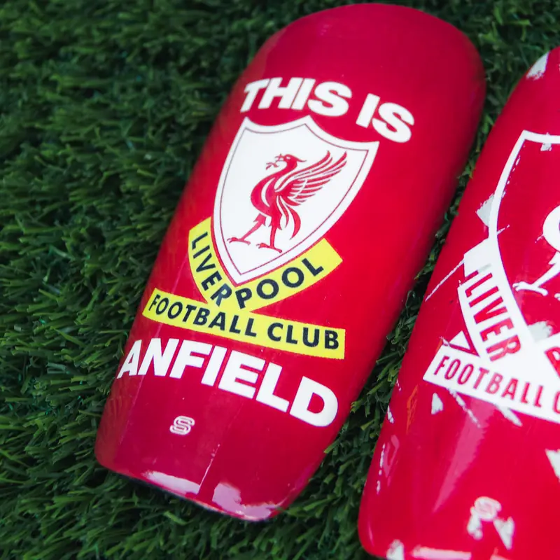 Red Liverpool-style custom shin pads with This Is Anfield design