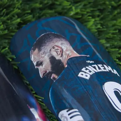 Custom shin pad showing a player from behind with name and number