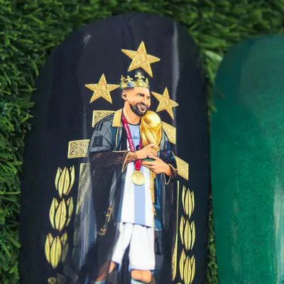 Custom shin pad with a gold crown and stars design
